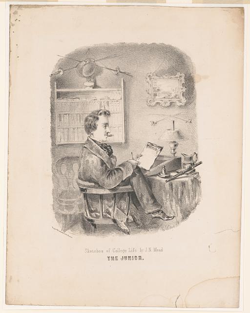 Sketch of student sitting at a desk. He is looking towards the camera and is holding a piece of paper and a stylus in his hands. There is a candle at his desk, and picture and book care on the wall. It is captioned "Sketches of the College Life by J.N. Mead. The JUNIOR."