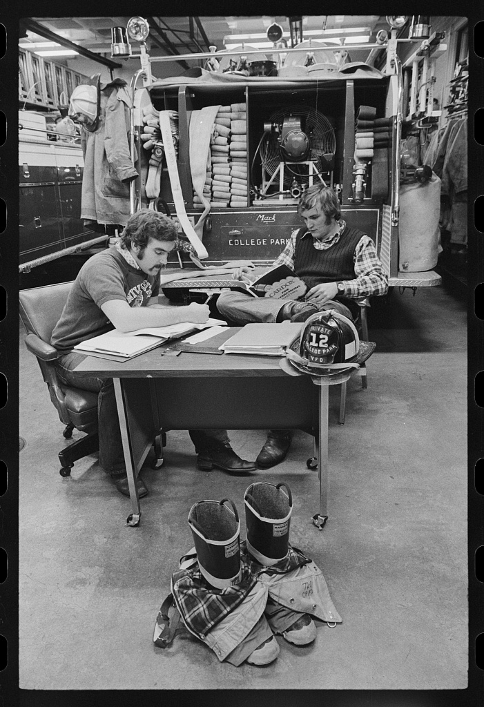 College students working as firemen, Photograph
